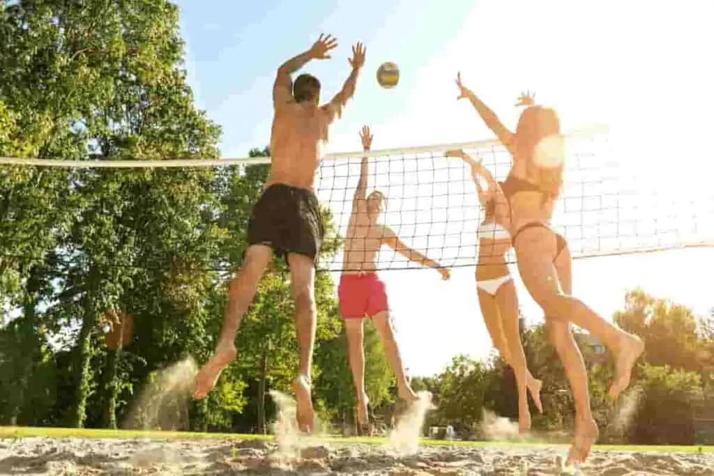 fun for all when playing beach volleyball- BrightSwirl