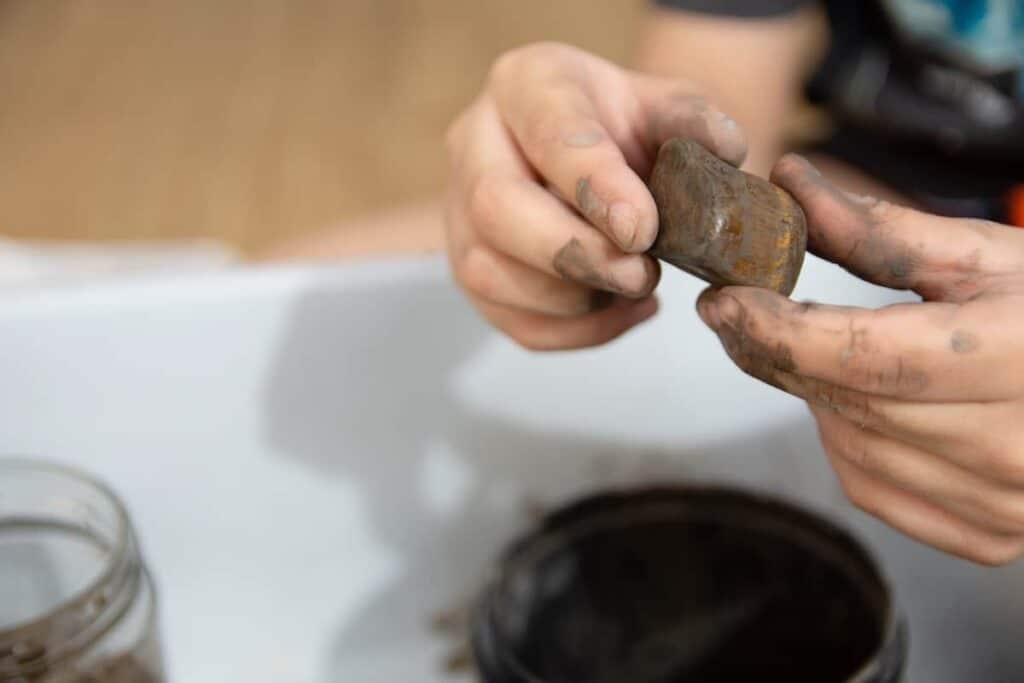 Cleaning and shaping the rock before polishing