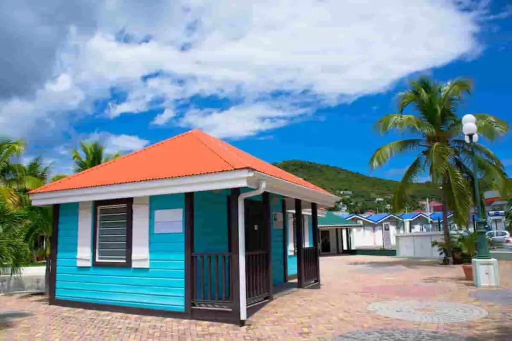 a small blue beach house rental cabin is available on island beaches, How Much Does it Cost to Rent a Beach House? Renting vs. Buying: [Surprising Facts] Guide to Vacation Rentals, how much is a beach house, how much does a beach house cost to rent, how much are beach houses to rent, how much to rent a beach house, how much does it cost to rent a beach house for a week, how much does a beach house cost, how much is it to rent a beach house