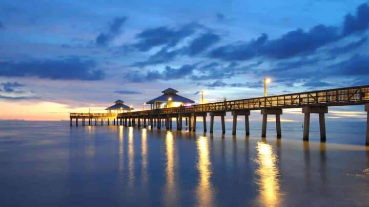 bridge pier over the water at sunset, Towns Near Fort Myers with a Beach- 5 Surprising Best Beaches