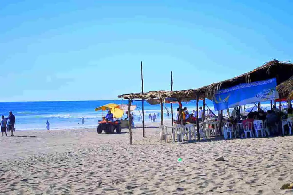 cart driving on the sand with tent nearby, Chiapas Beach Towns- 11 Surprising Towns with Best Beaches [Plus Map of Beach in Chiapas], chiapas mexico beaches, mexico beaches, towns with a beach in chiapas, beaches in chiapas, chiapas beaches, chiapas beach towns, chiapas beach