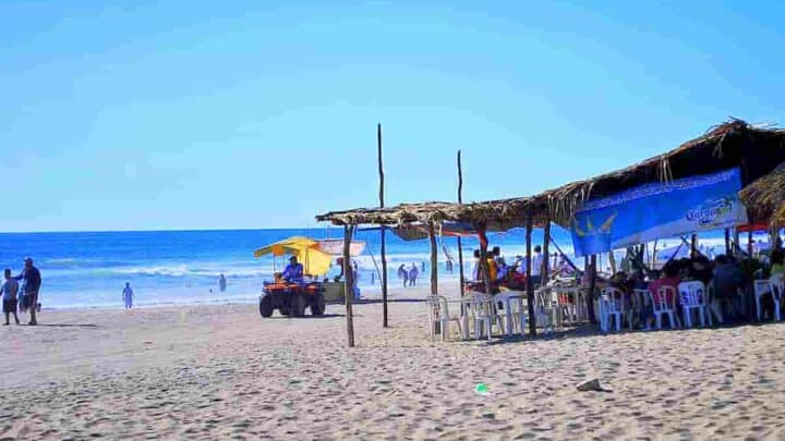 cart driving on the sand with tent nearby, Chiapas Beach Towns- 11 Surprising Towns with Best Beaches [Plus Map of Beach in Chiapas]