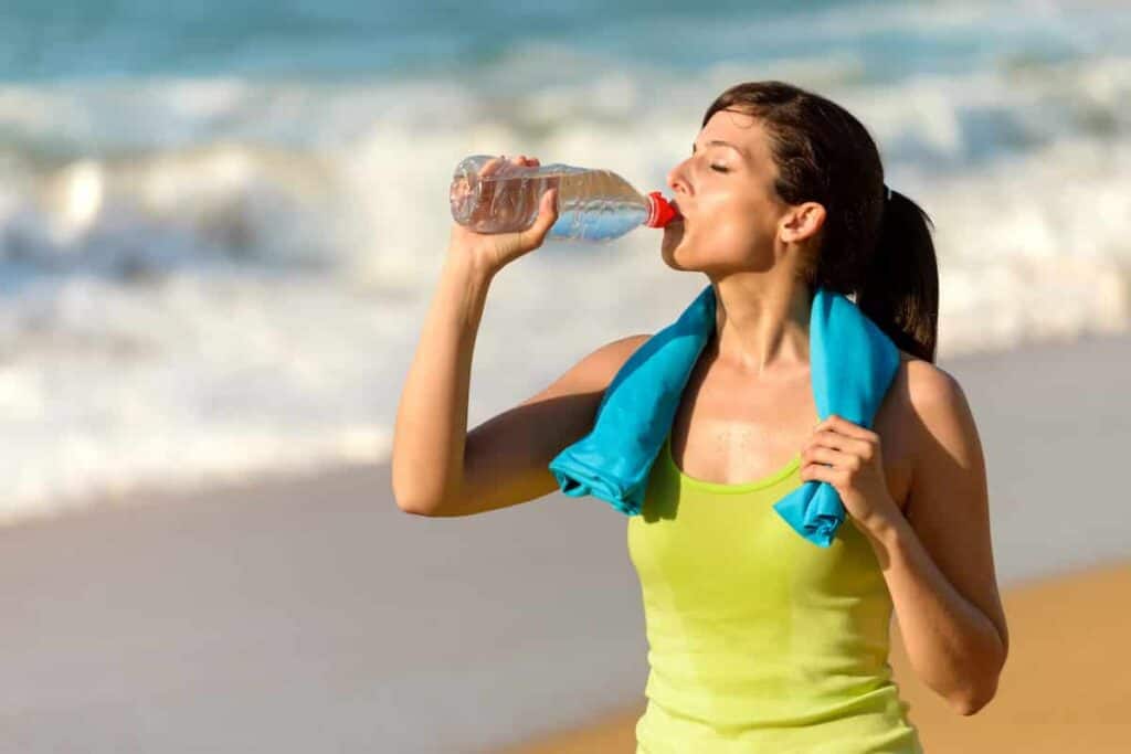 Beach travel tips drink lots of water use water bottles