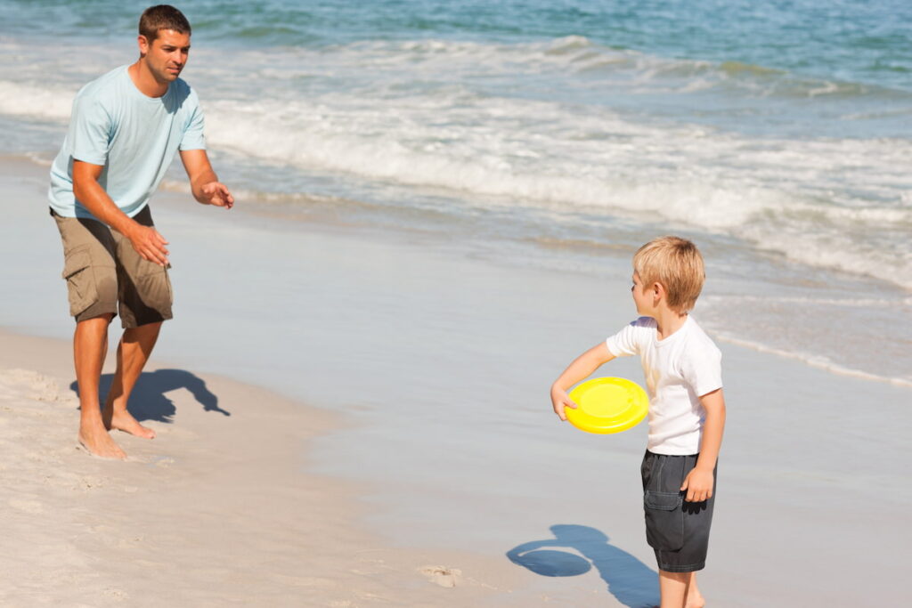 Playing frisbee is one of the fun activities you can do at the beach