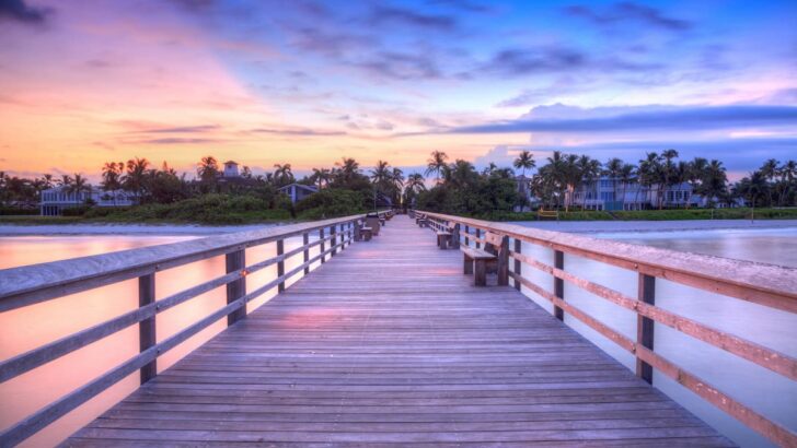 a long walkable boardwalk at sunset, 11 Best Walkable Beach Towns in Florida Pedestrian Friendly Travel Guide [for Beach Lovers]