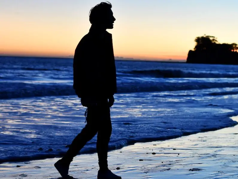 silhouette of man standing on beach during sunset, 21 [Best] Beach Photo Ideas for Guys- Poses Make The Difference, beach photo ideas for guys, beach poses for men, Action Shots on Beach, beach poses man, beach pose ideas, Mens Beach Poses, beach pictures poses man