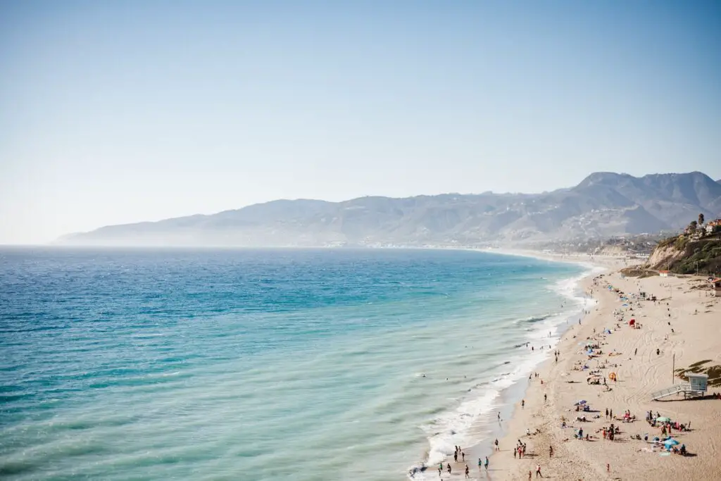 aerial view of beach in Spain with blue ocean water during daytime, 2024 Best Towns Near Barcelona With A Beach: 15 Tops Spots, barcelona beach, best coastal towns near barcelona, barcelona beach resorts, cities near barcelona, beach resorts near barcelona, beach towns near barcelona, best beach towns near Barcelona