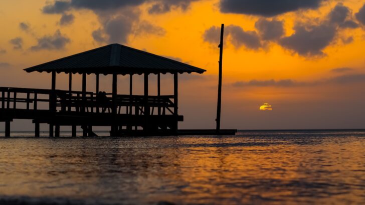 brown gazebo near body of water, Small Beach Towns In Alabama Top 7 Charming Spots