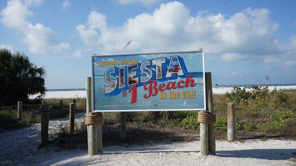 a sign for a restaurant on the beach, Towns Near Sarasota, Florida with a Beach- 10 [Best] Beaches with Surprising Beach Vibe, best beaches near sarasota, small towns near sarasota fl, cities near sarasota fl, beaches near sarasota, beaches in sarasota, beaches sarasota, towns near sarasota with a beaches