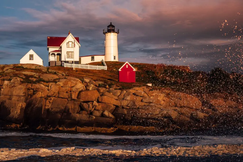 white and red lighthouse on brown rock formation during night time, 13 Prettiest Coastal Towns to Visit in Maine in Autumn-[Surprising Beautiful] Seaside, maine coastal towns, places to visit in maine in the fall, best beach towns in maine, best coastal towns in maine, best towns in maine to visit in fall, coastal towns in maine, best places to visit in maine in the fall, coastal towns to visit in maine in autumn
