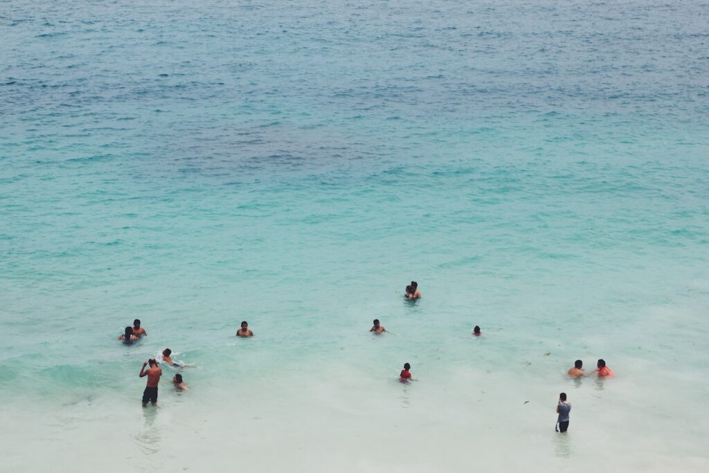 people swimming on body of water, La Paz Beaches Mexico - 7 Amazing Beaches [Surprising Fun]