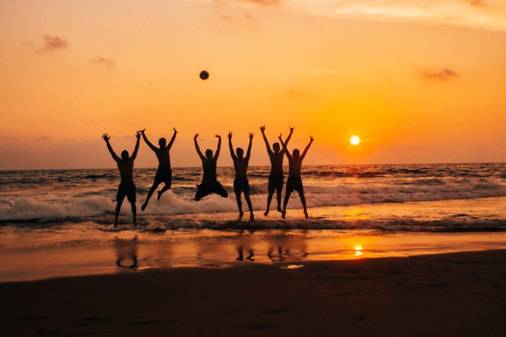 time lapse photography of group of people jumping on seashore under golden hour, Top 9 Beach Ball Games for Fun at the Beach : Beach Ball Games For Kids, beachball game, fun games with beach ball, best beach ball, beach ball game, beach games with balls, best beach games, beach ball games for adults, beach ball games
